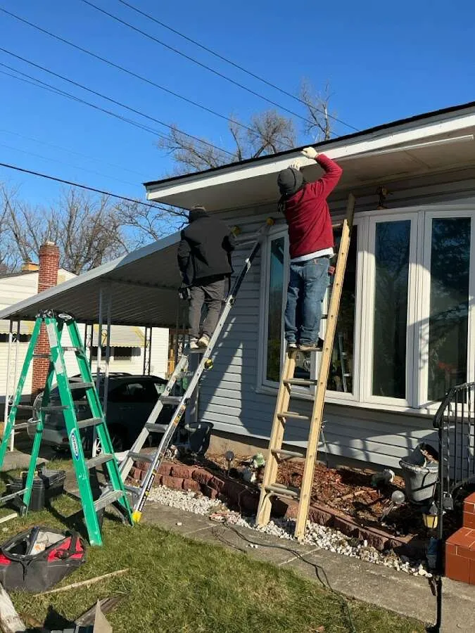 Restoration crew performing exterior repair in Troy